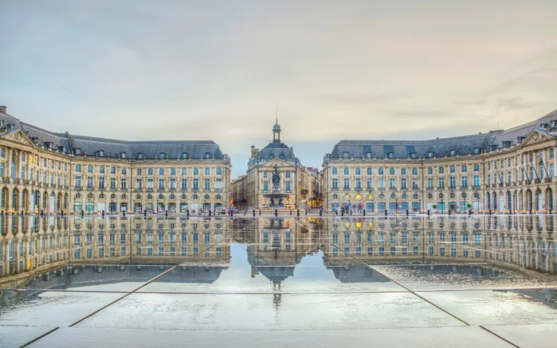 Place de la Bourse and the iconic water mirror in Bordeaux, France.